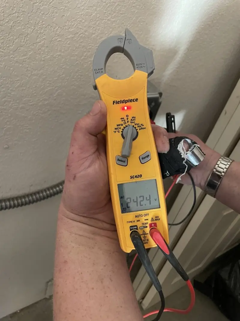 Voltage testing with clamp meter during Generator Installation in Country Homes